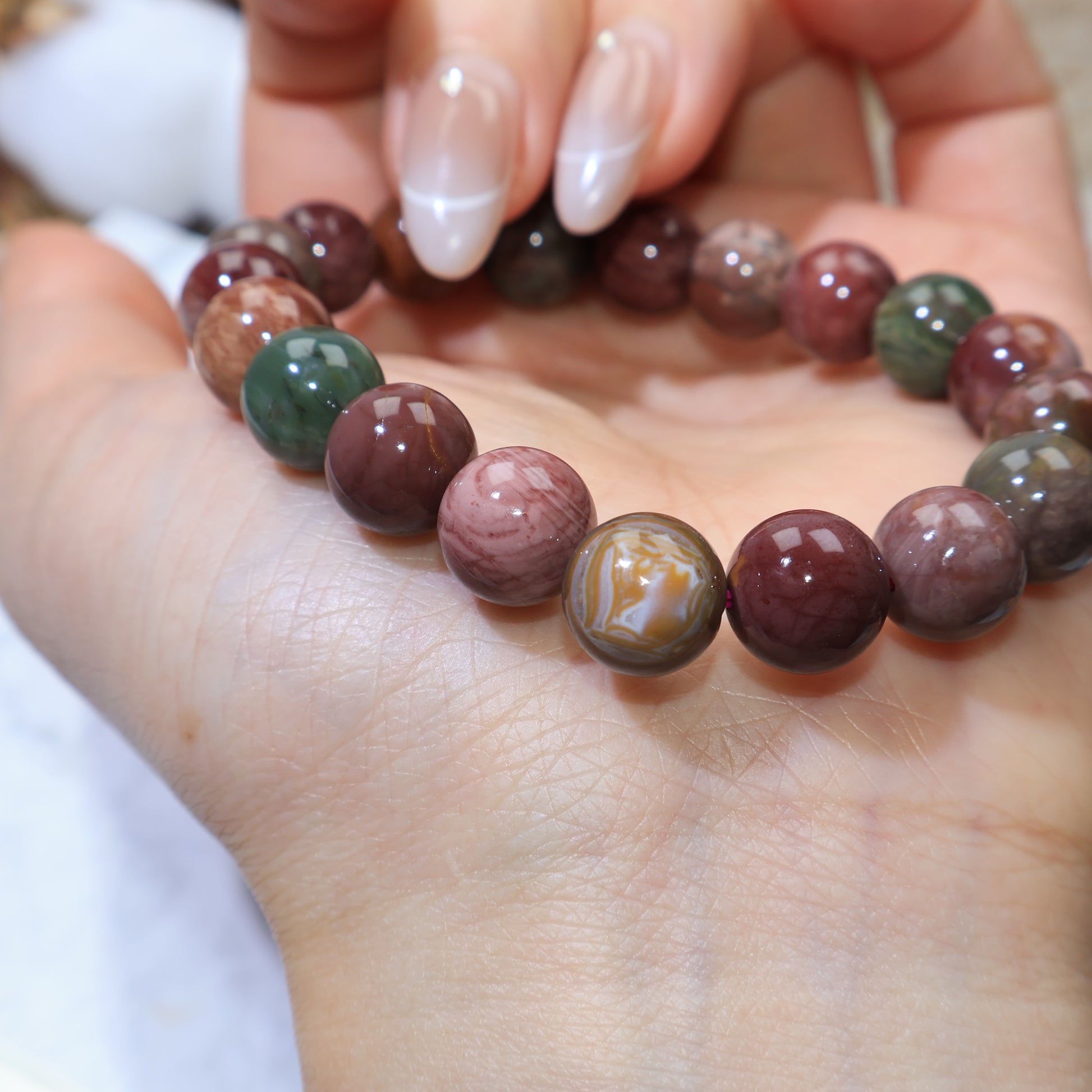 Angle view showing contrasting green and reddish-brown beads