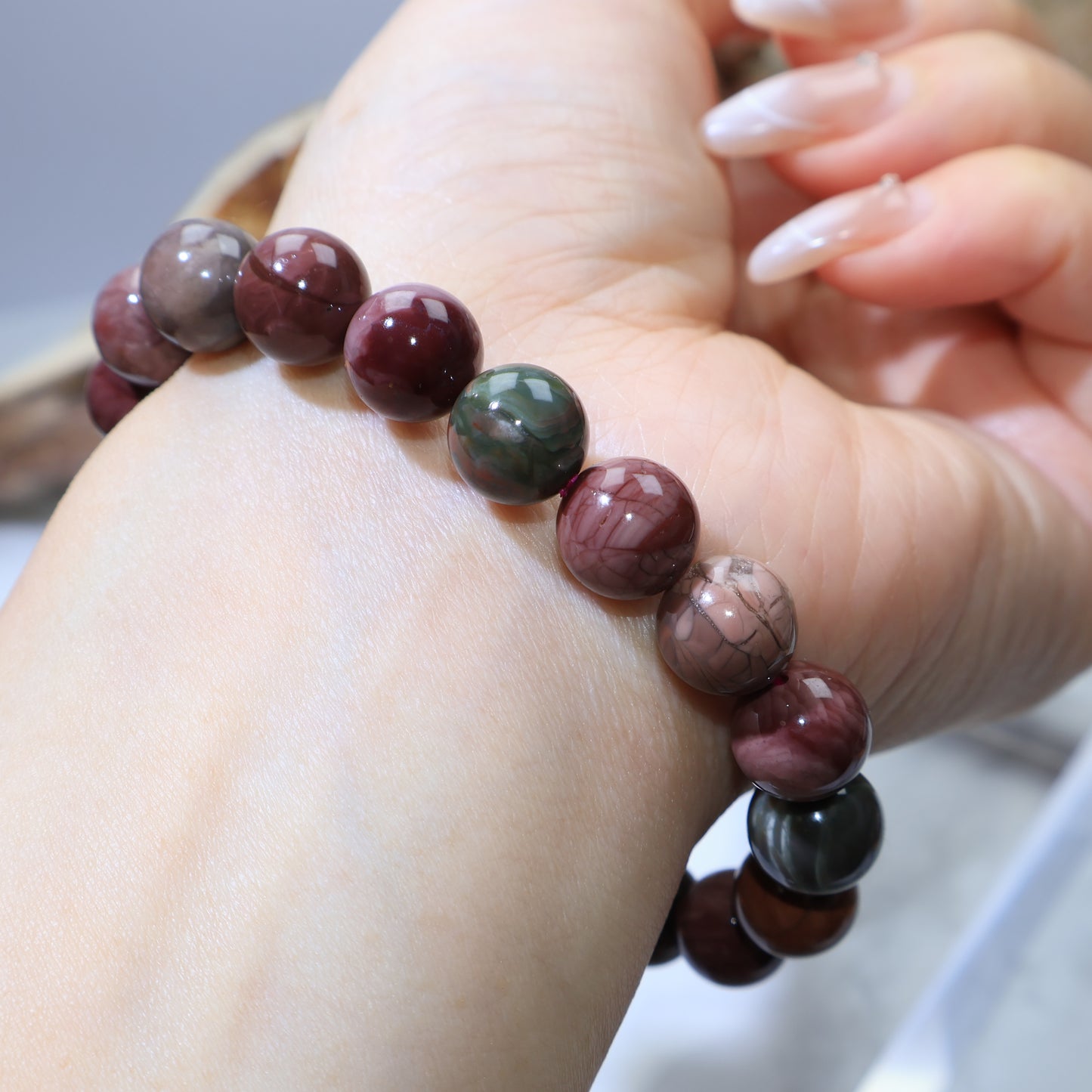 Reverse wrist shot showing symmetrical bead arrangement and earthy tones