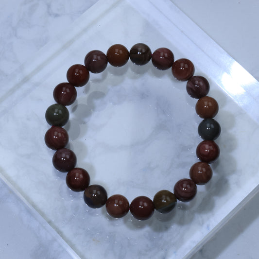 Top view of Desert Harmony Alashan Agate bracelet on marble background