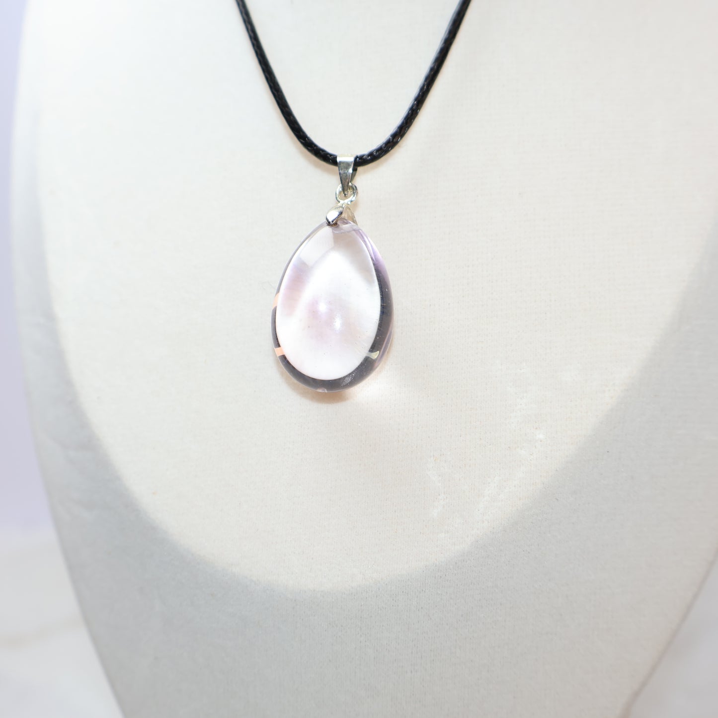 Transparent natural Amethyst pendant with purple mountain inclusions