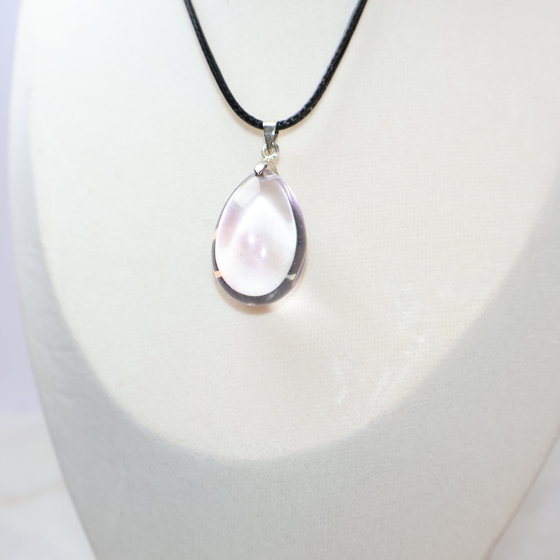 Transparent natural Amethyst pendant with purple mountain inclusions