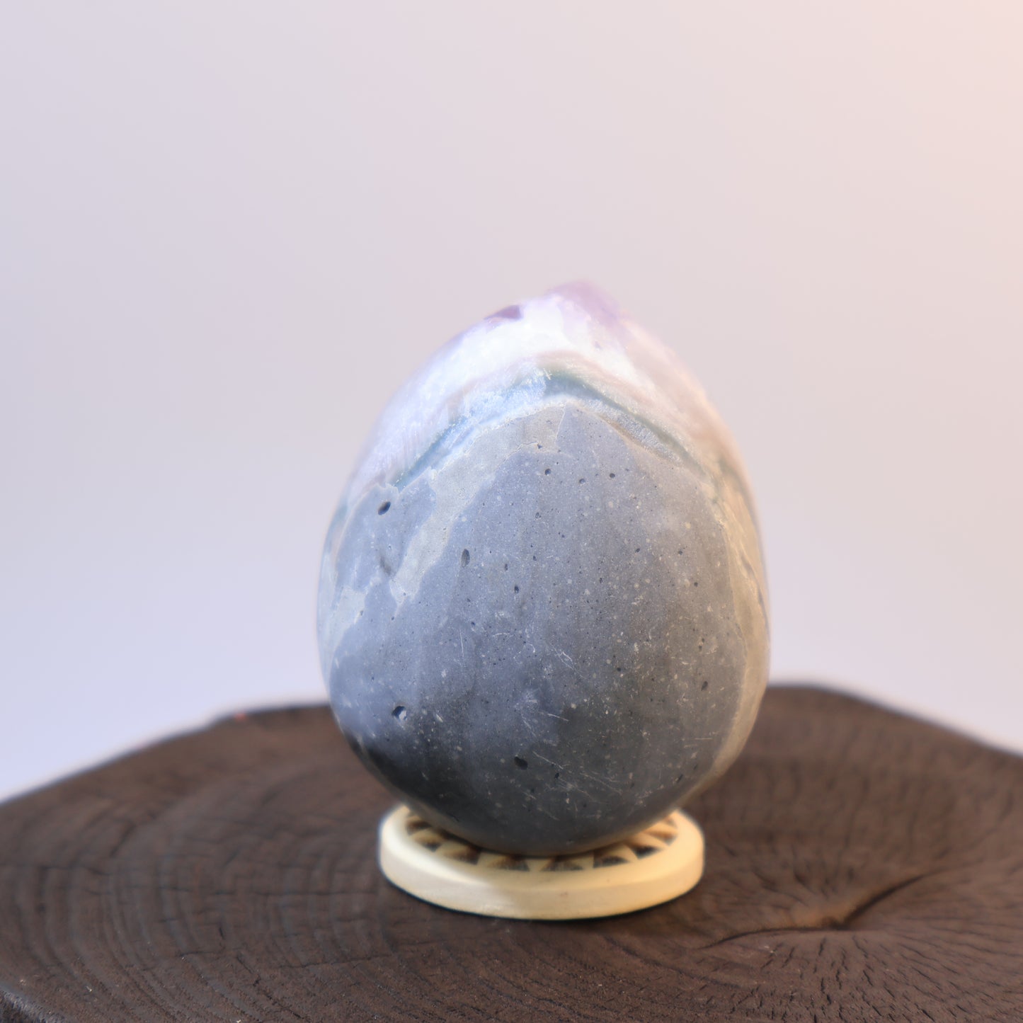 Back view of Amethyst egg with smooth polished surface and natural lines.