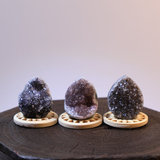 Three mini geode eggs set – two grey and one purple, front view.