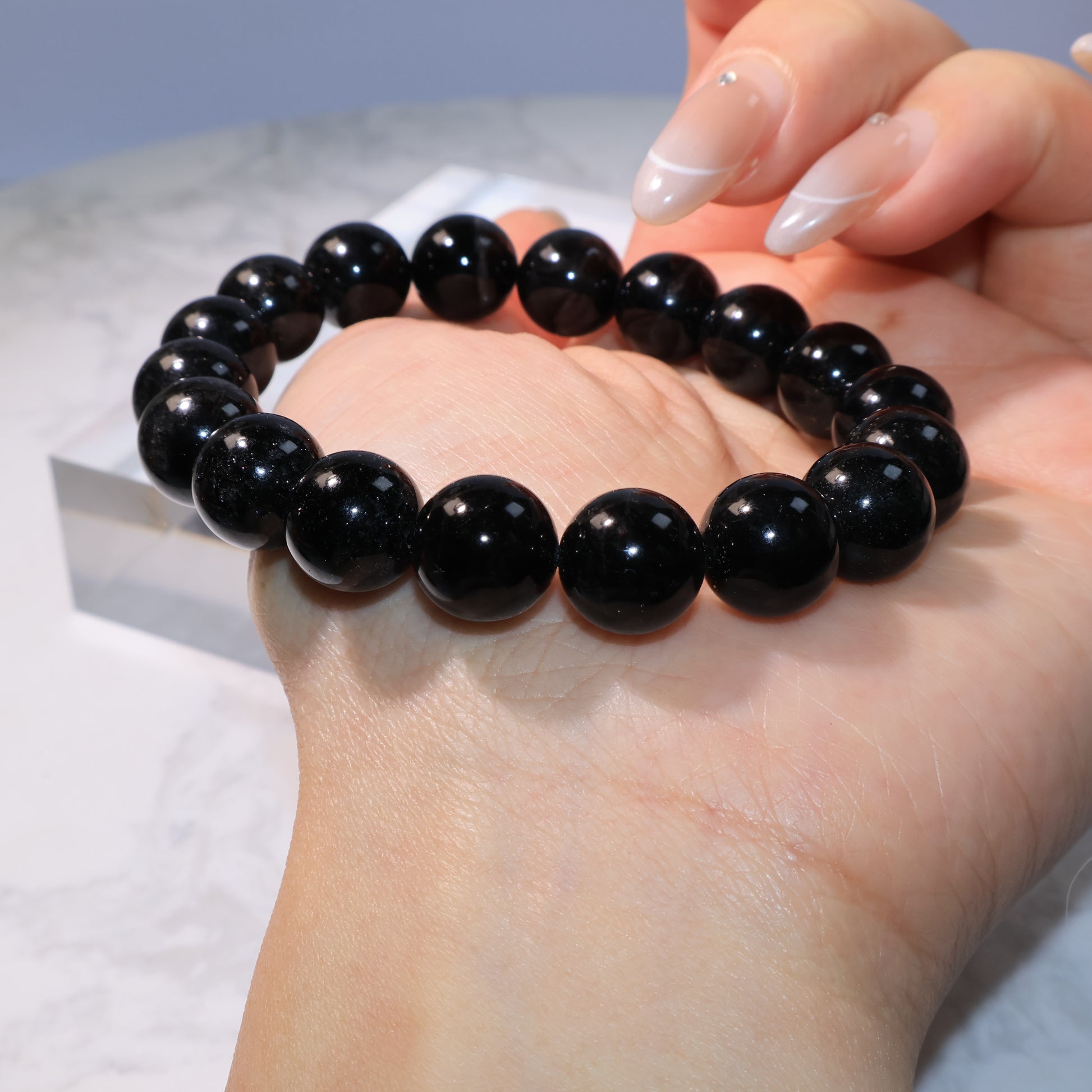 Black Rutilated Quartz Bracelet – elegant wrist display highlighting bead shine.