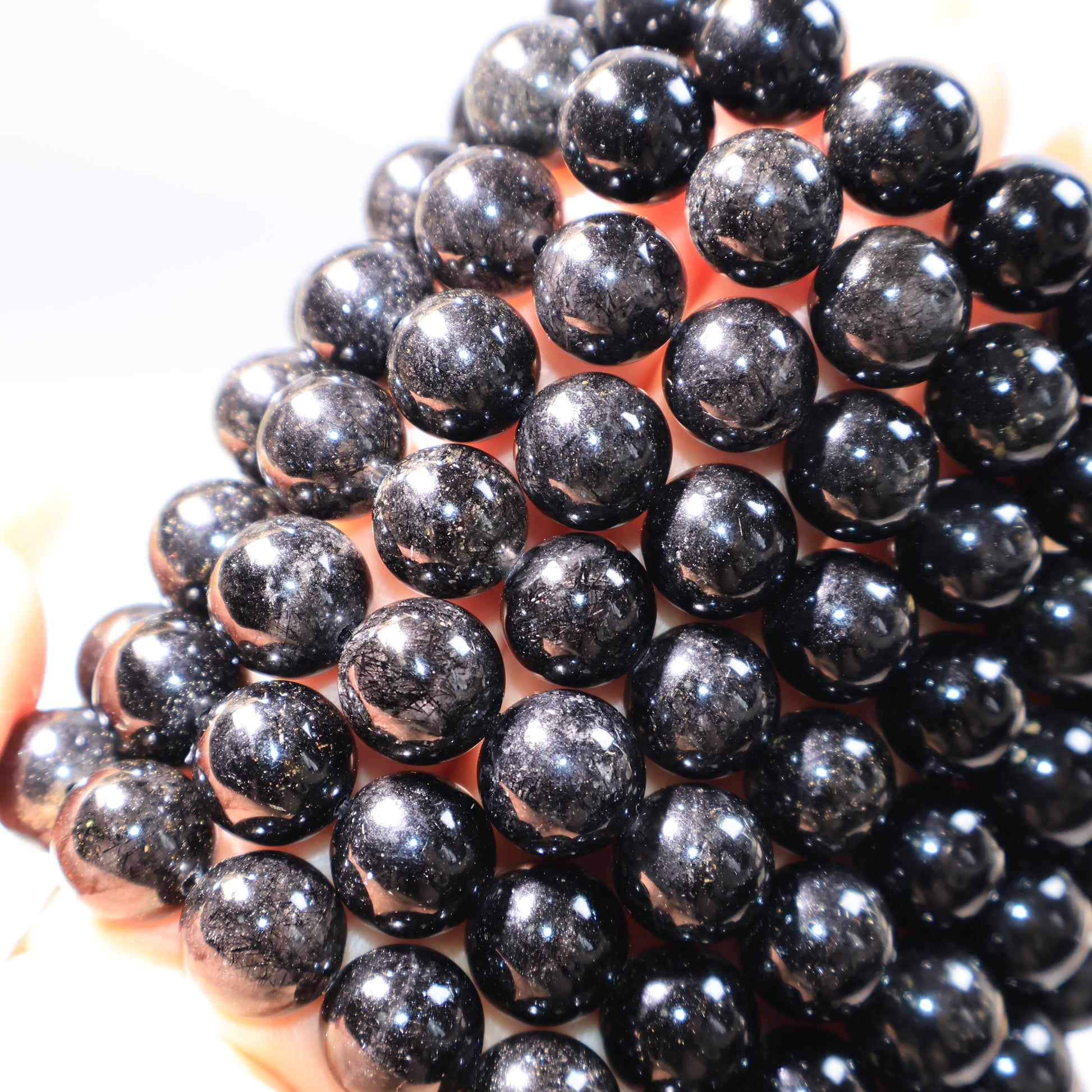Black Rutilated Quartz Bracelets – close-up showing needle-like inclusions inside beads.