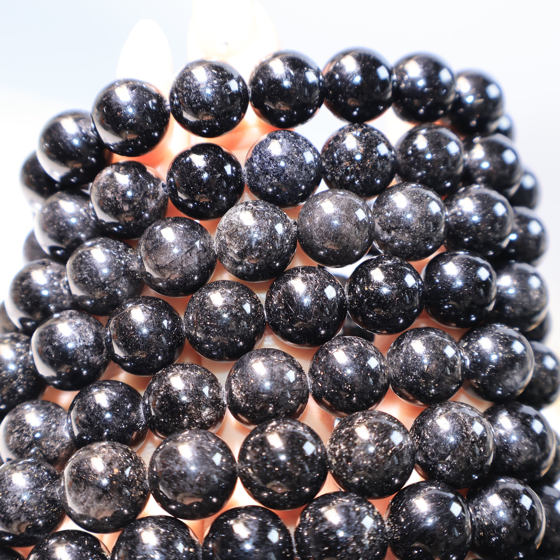 Stacked Black Rutilated Quartz Bracelets – dark glossy appearance with dense rutile.
