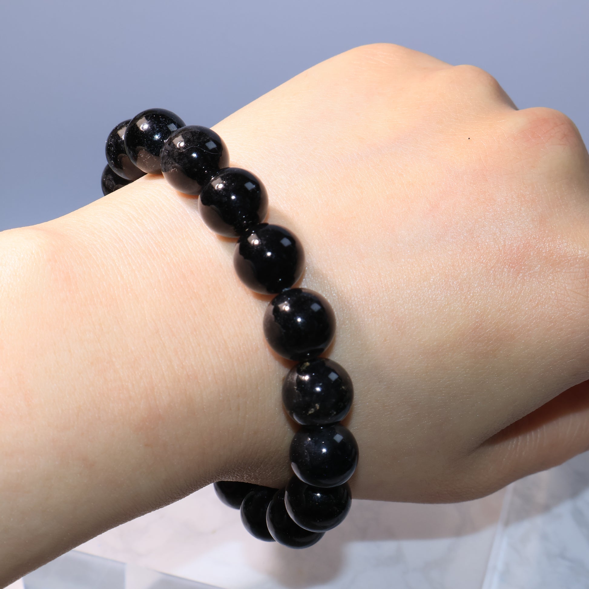 Black Rutilated Quartz Bracelet – worn on wrist, showing natural gemstone beauty.
