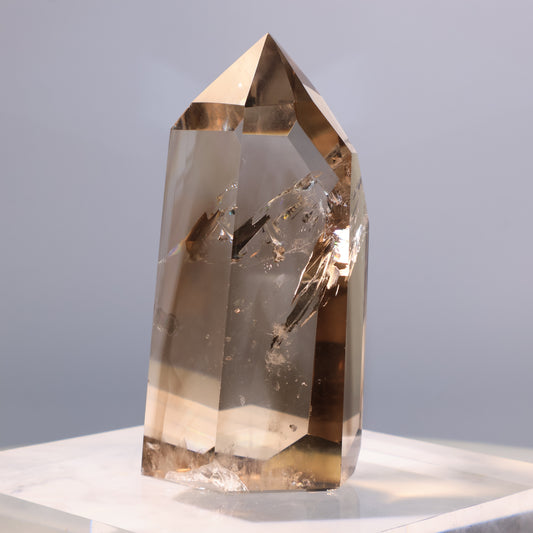 Smoky Quartz Tower – 206g crystal with pointed termination, showing clear transparency.