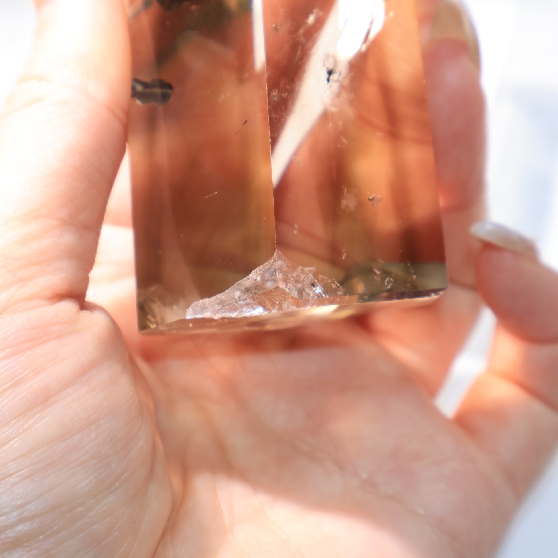 Smoky Quartz Tower – close-up of the bottom with cotton inclusions.