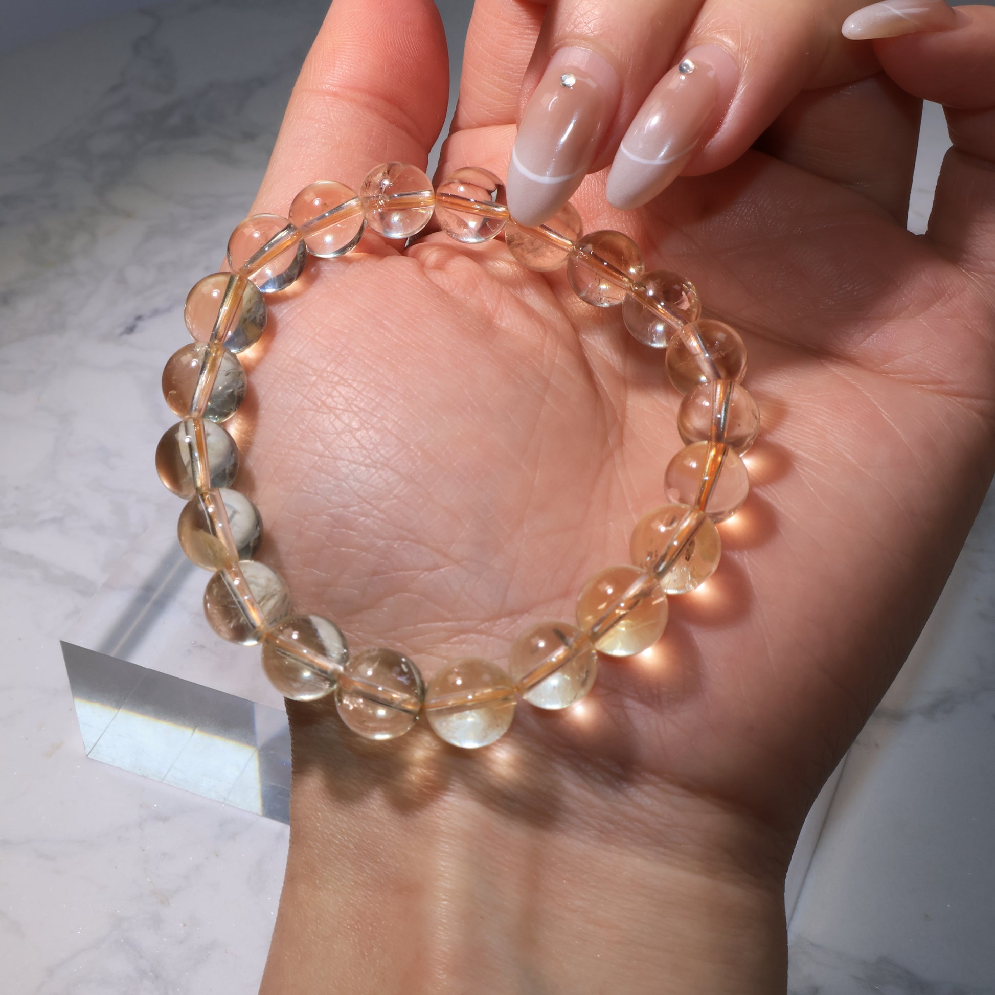 Close-up of citrine bracelet, highlighting natural ice cracks and rainbow flashes.