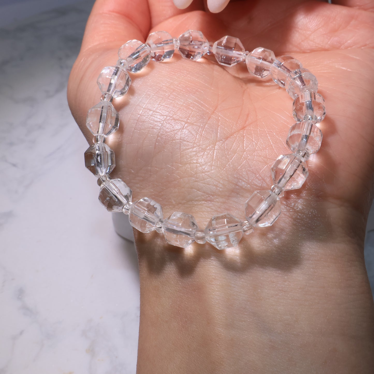 Bracelet encircling the wrist, showcasing balanced bead arrangement.