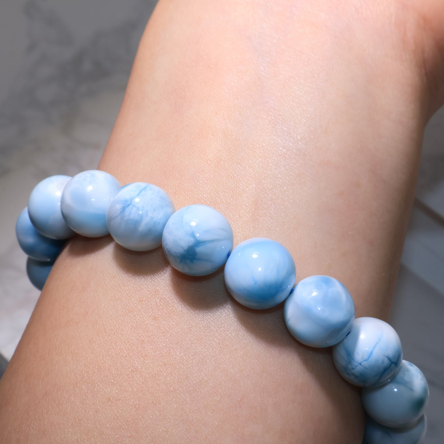 Another angle of Larimar bracelet on wrist, highlighting natural ocean-like colors.