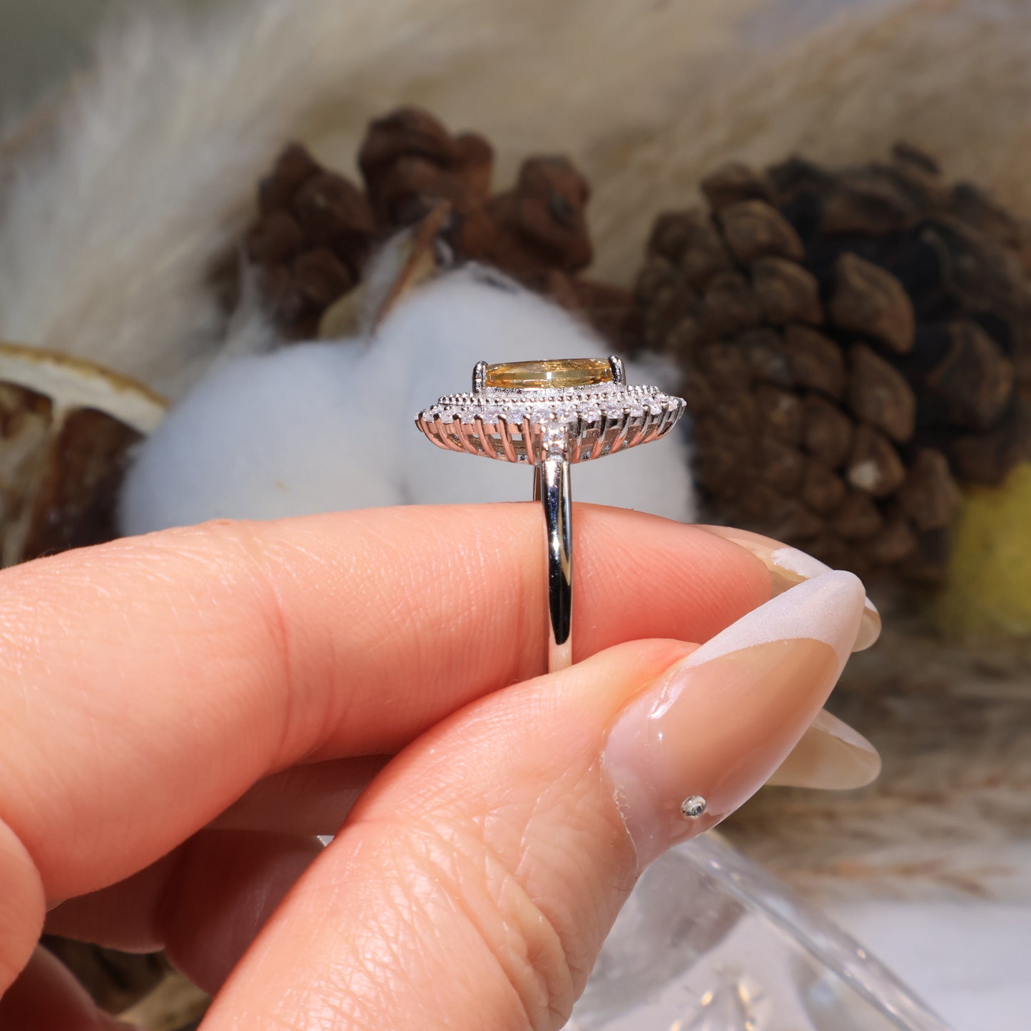 Profile view showing the raised gemstone mount and silver band craftsmanship.