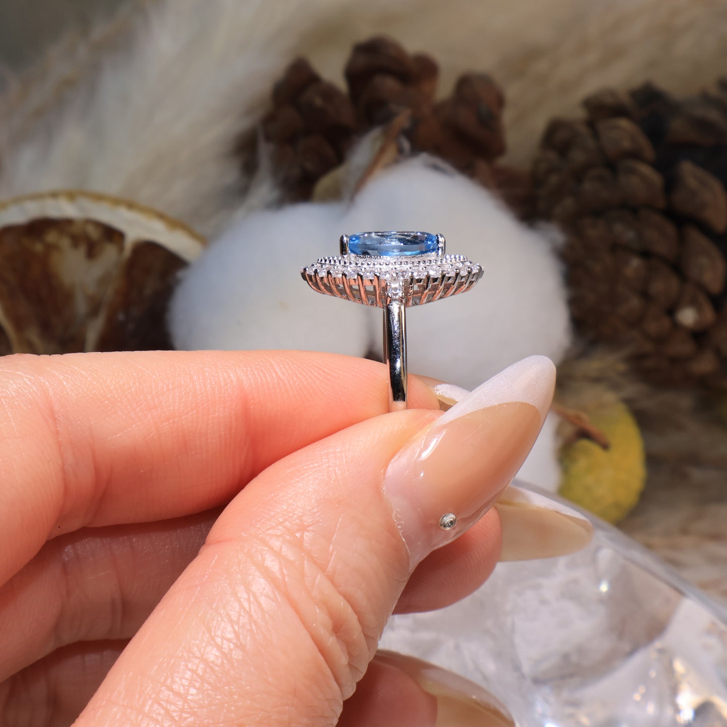 Profile view highlighting the raised gemstone setting and open structure for maximum sparkle.