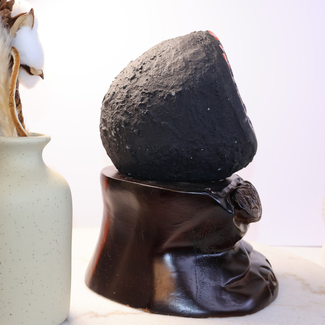Side View of Natural Amethyst Geode Crystal Cave on Dark Wooden Base