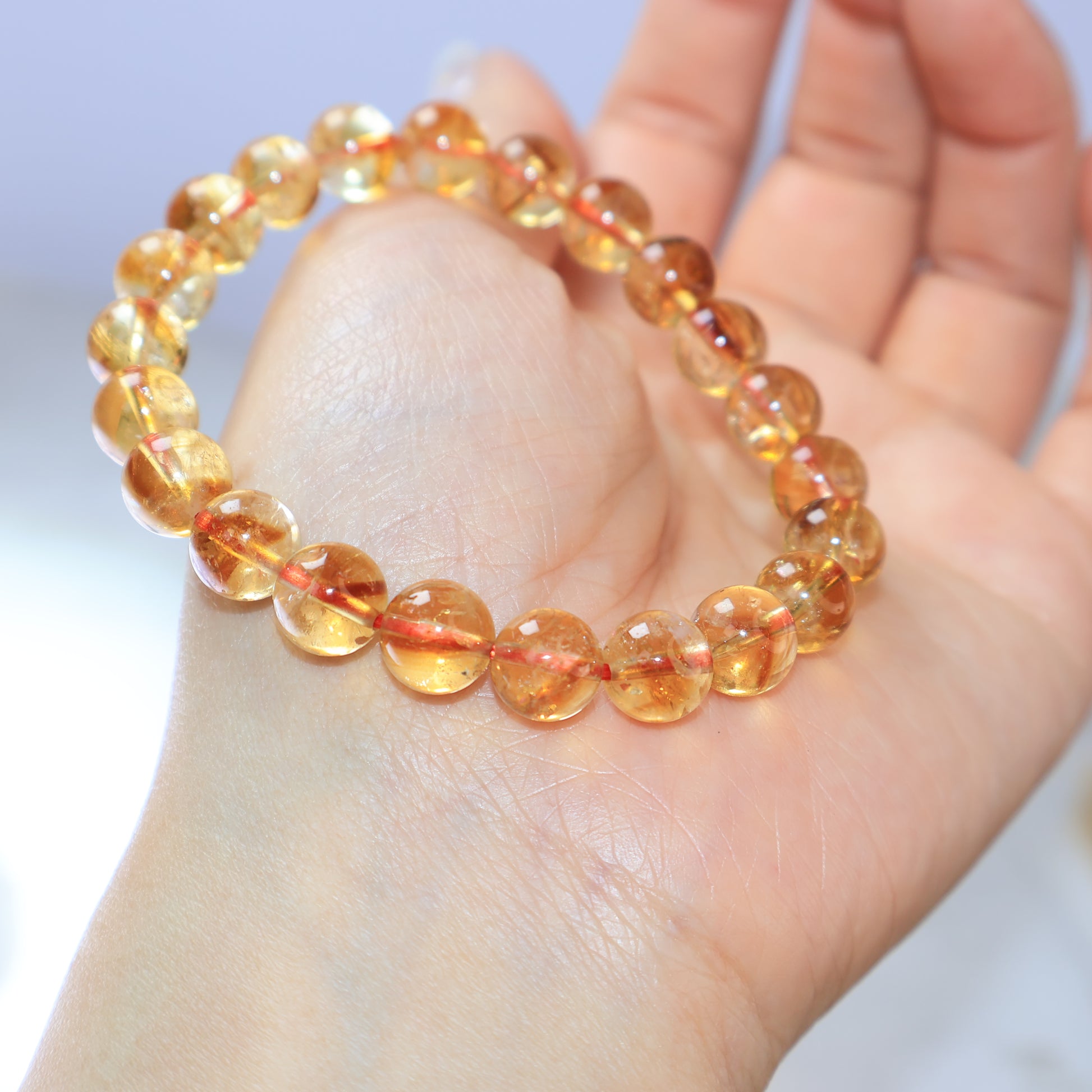 Citrine bracelet worn on wrist showing warm golden glow