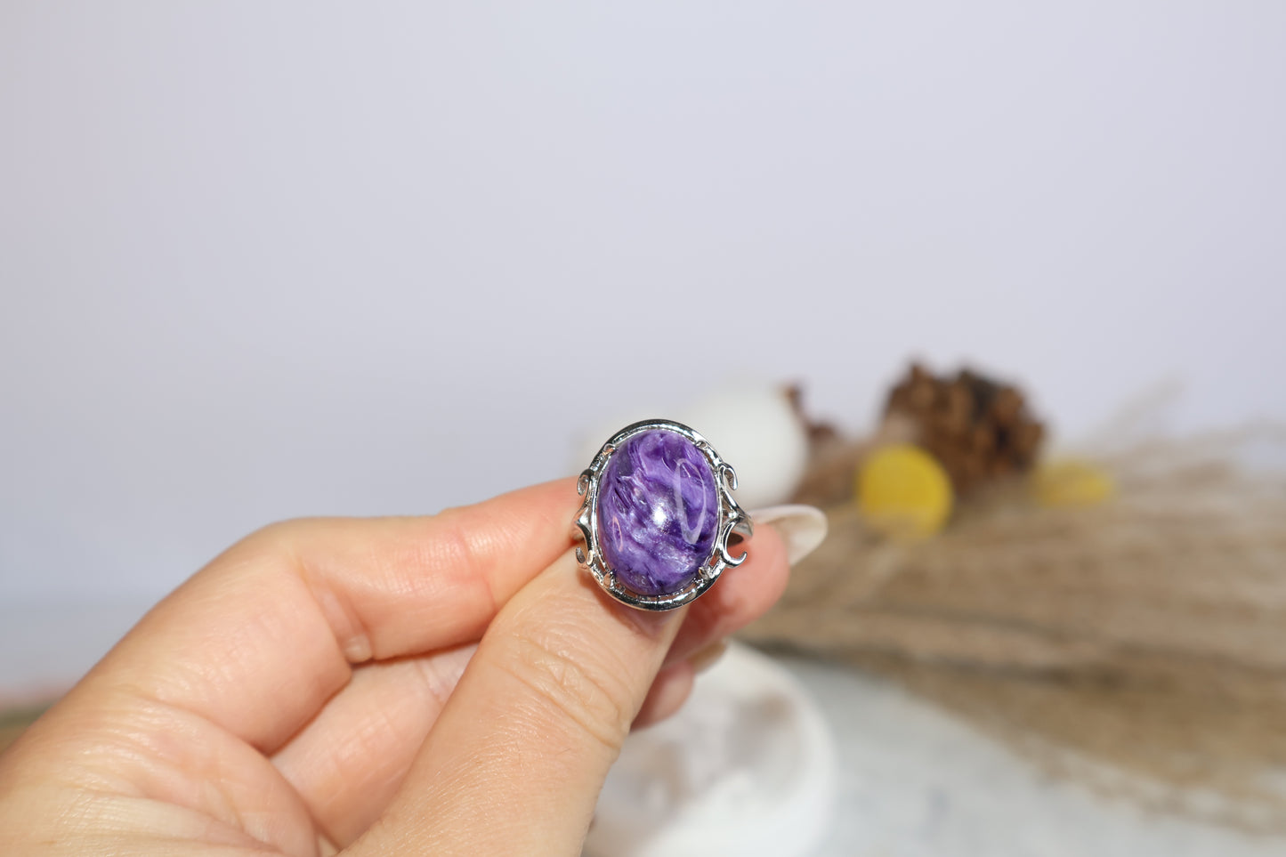 Close-up of 13×18mm purple charoite gemstone ring in claw setting