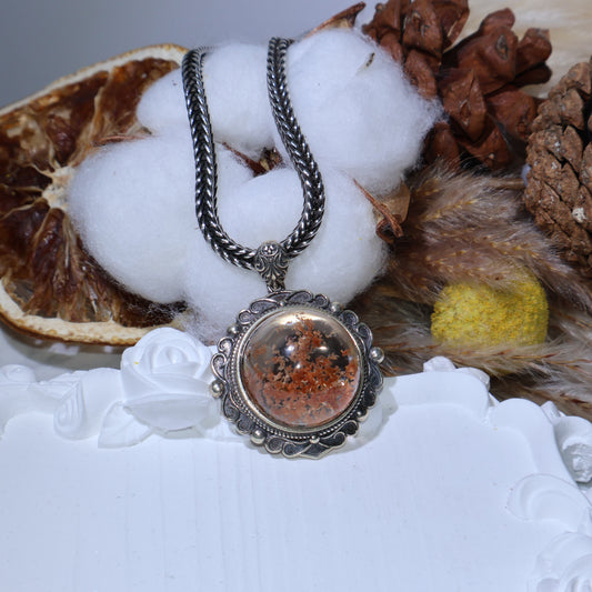 Close-up of phantom quartz pendant with S925 vintage silver frame