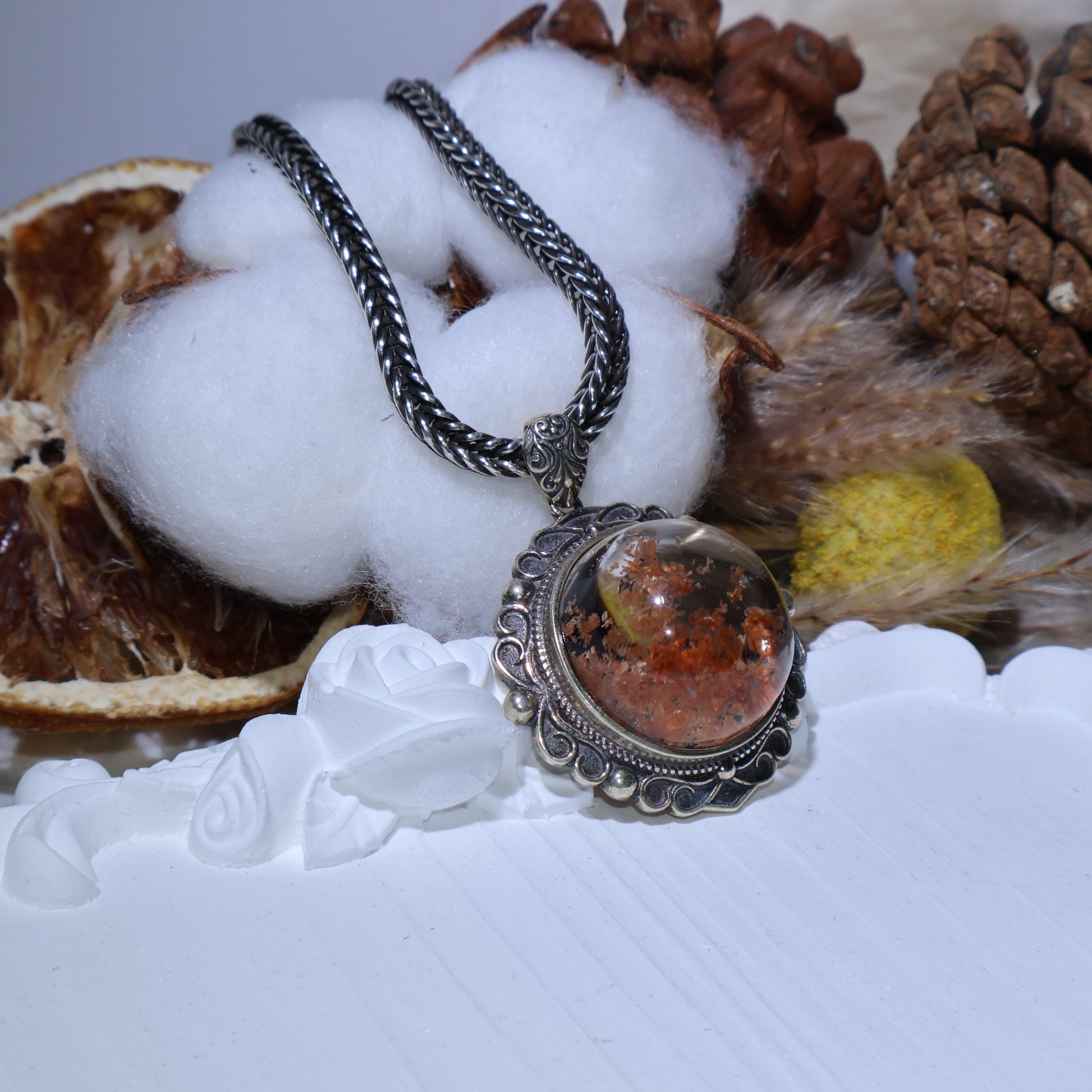 Side angle showing crystal dome and moss-like inclusions