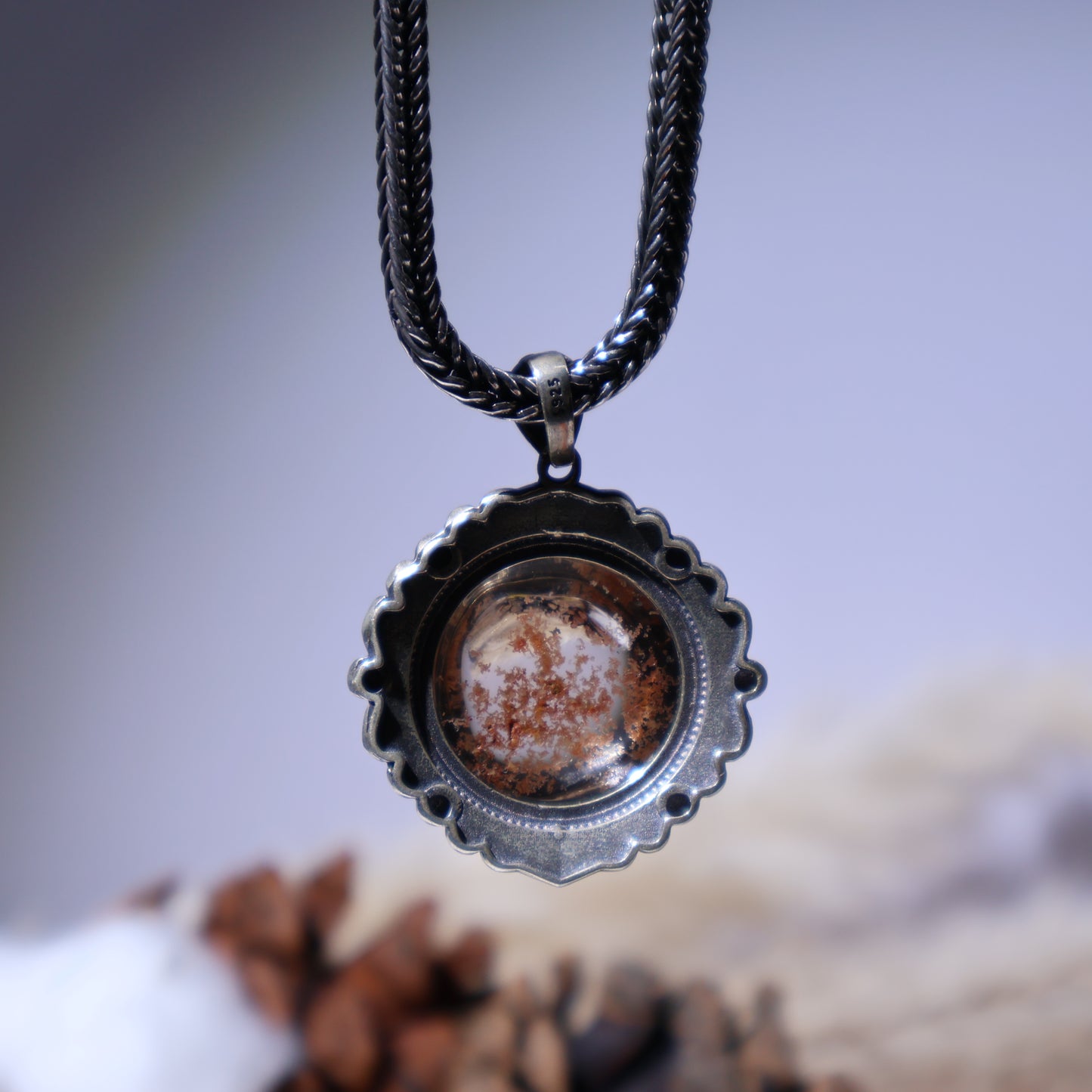 Back view of S925 silver pendant with textured edge