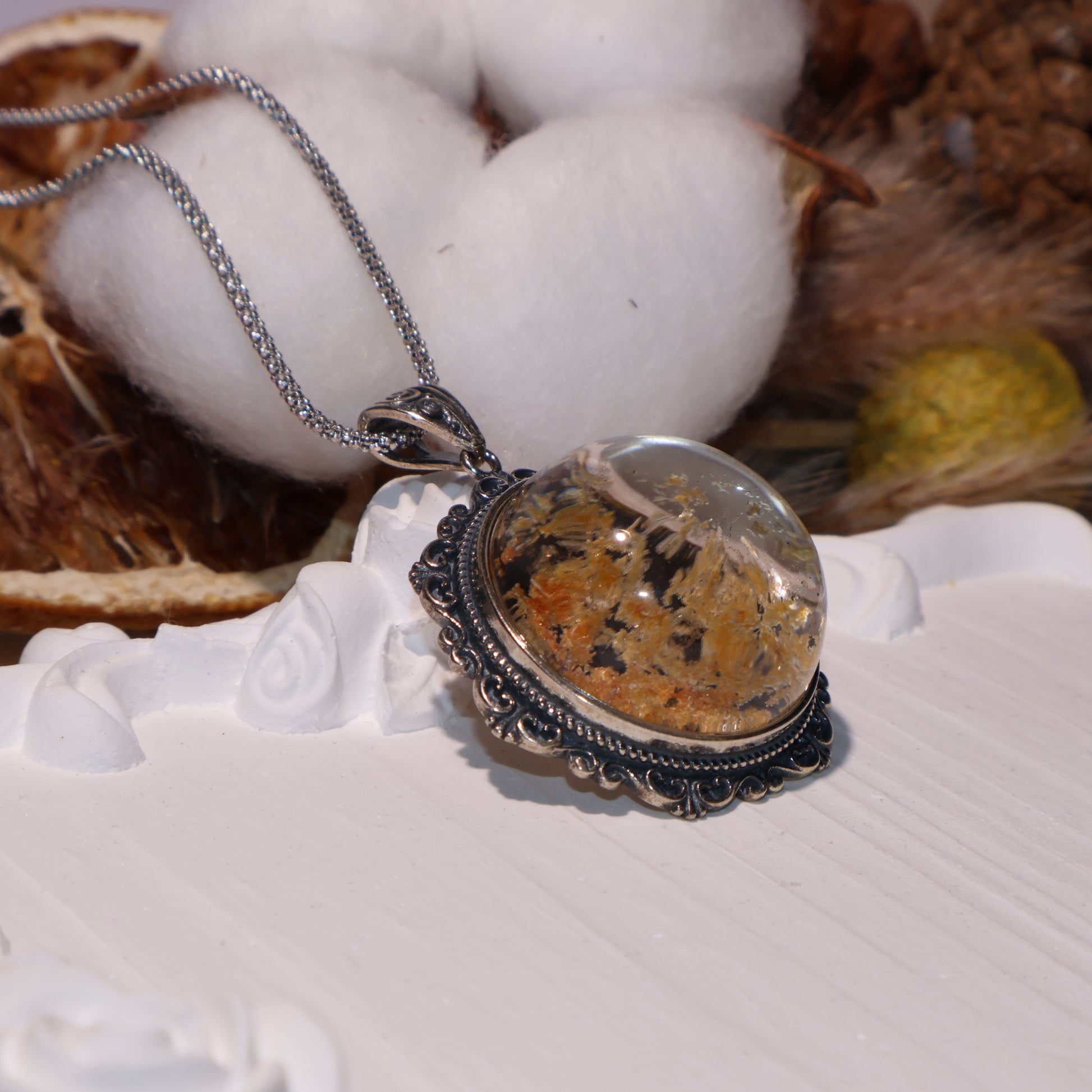 Side angle showing dome shape and dimensional clarity of the crystal.