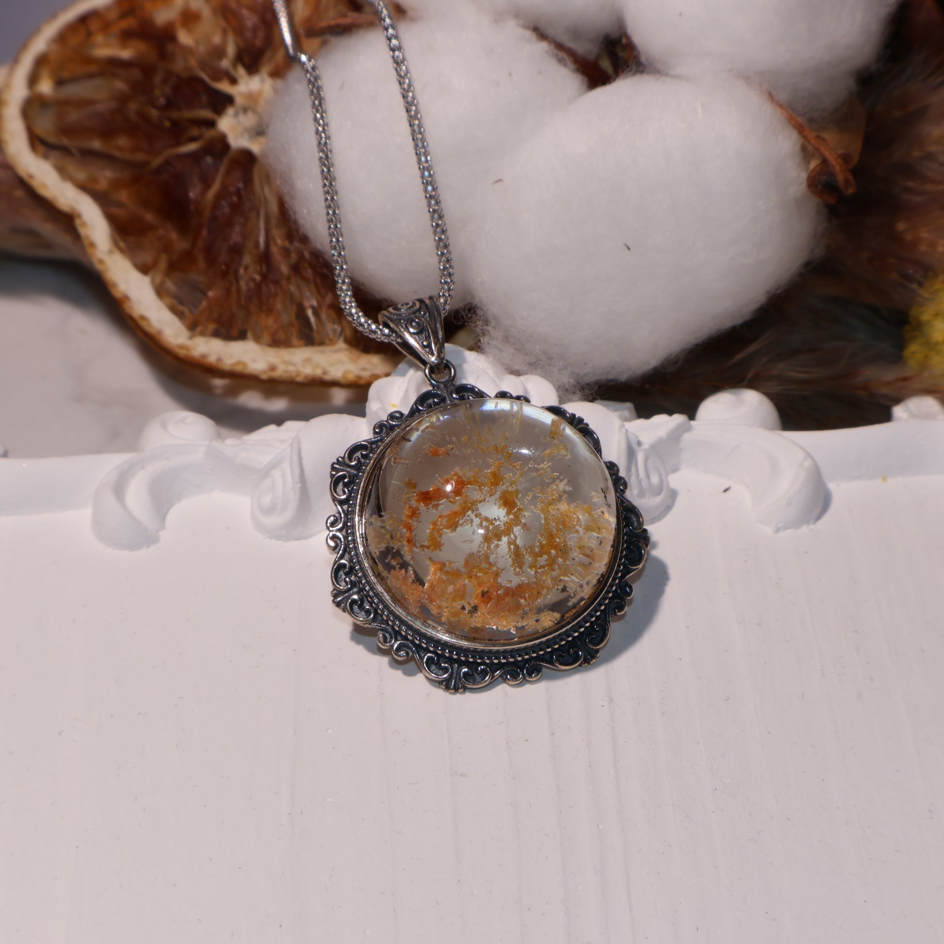 Side angle showing dome shape and dimensional clarity of the crystal.