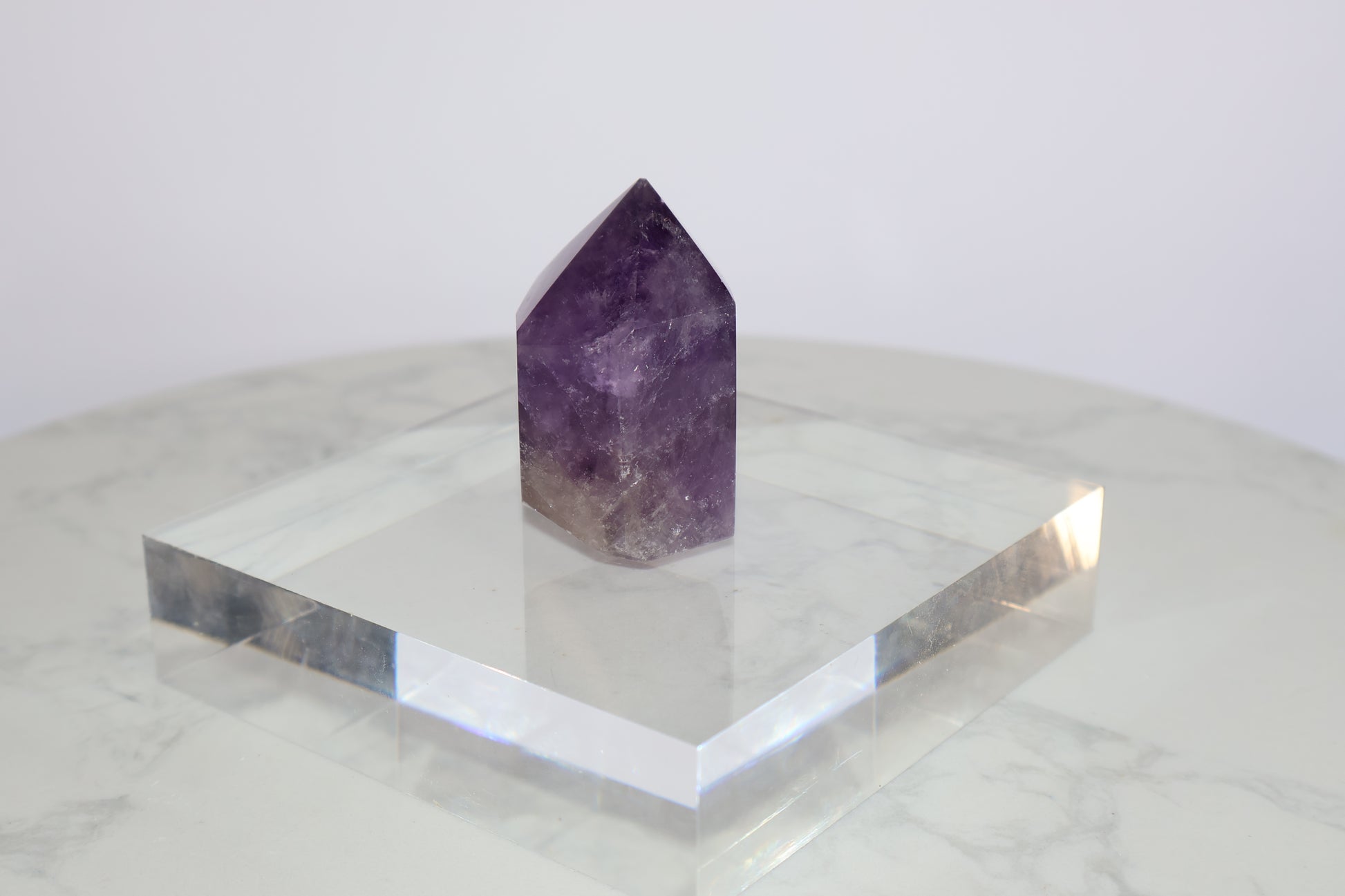 Side angle view of Royal Amethyst Tower No.01 – 98g Brazilian Crystal with natural layering and clarity